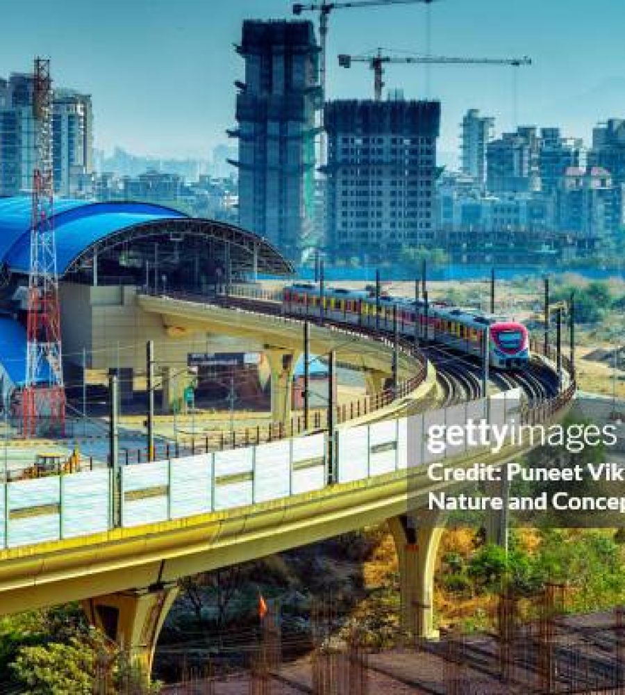 Elevated view of the Kharghar Metro Train Station and the train running over the Bridge  in Navi Mumbai, India.